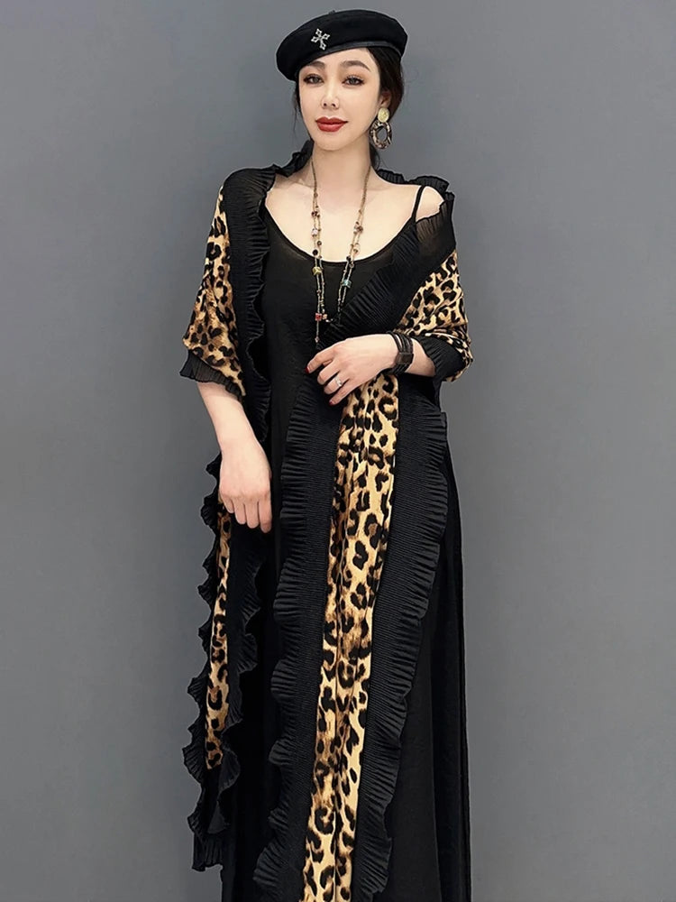 Unleash your fierce and elegant side with our Women's Elegant Leopard Print Shawl! This large wrap around shawl boasts a striking leopard print and is finished with a delicate black chiffon trim. Experience comfort and style in one luxurious accessory. Transform any outfit with this statement piece!