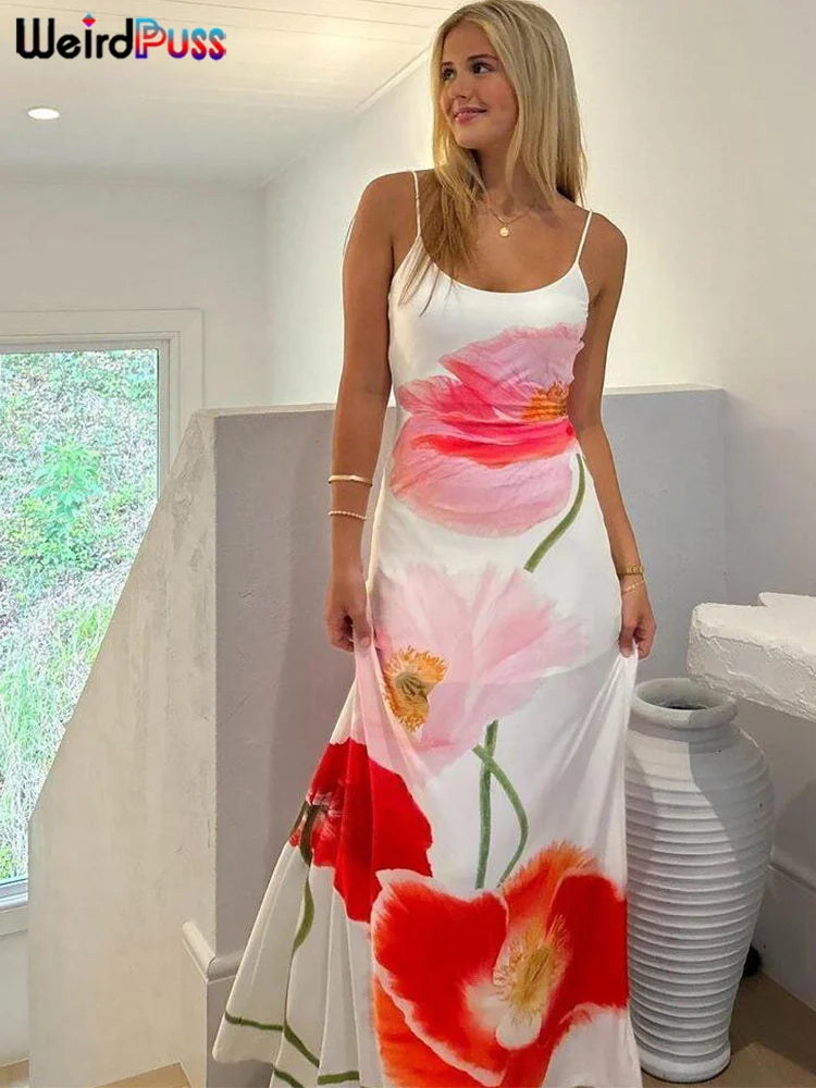 Take your summer style to the next level with our Summer Spaghetti Strap Maxi Length Backless Bodycon Dress. The white background beautifully contrasts with the vibrant pink, red, and orange flowers, making a bold statement. The flattering bodycon fit and backless design will make you stand out in any crowd.