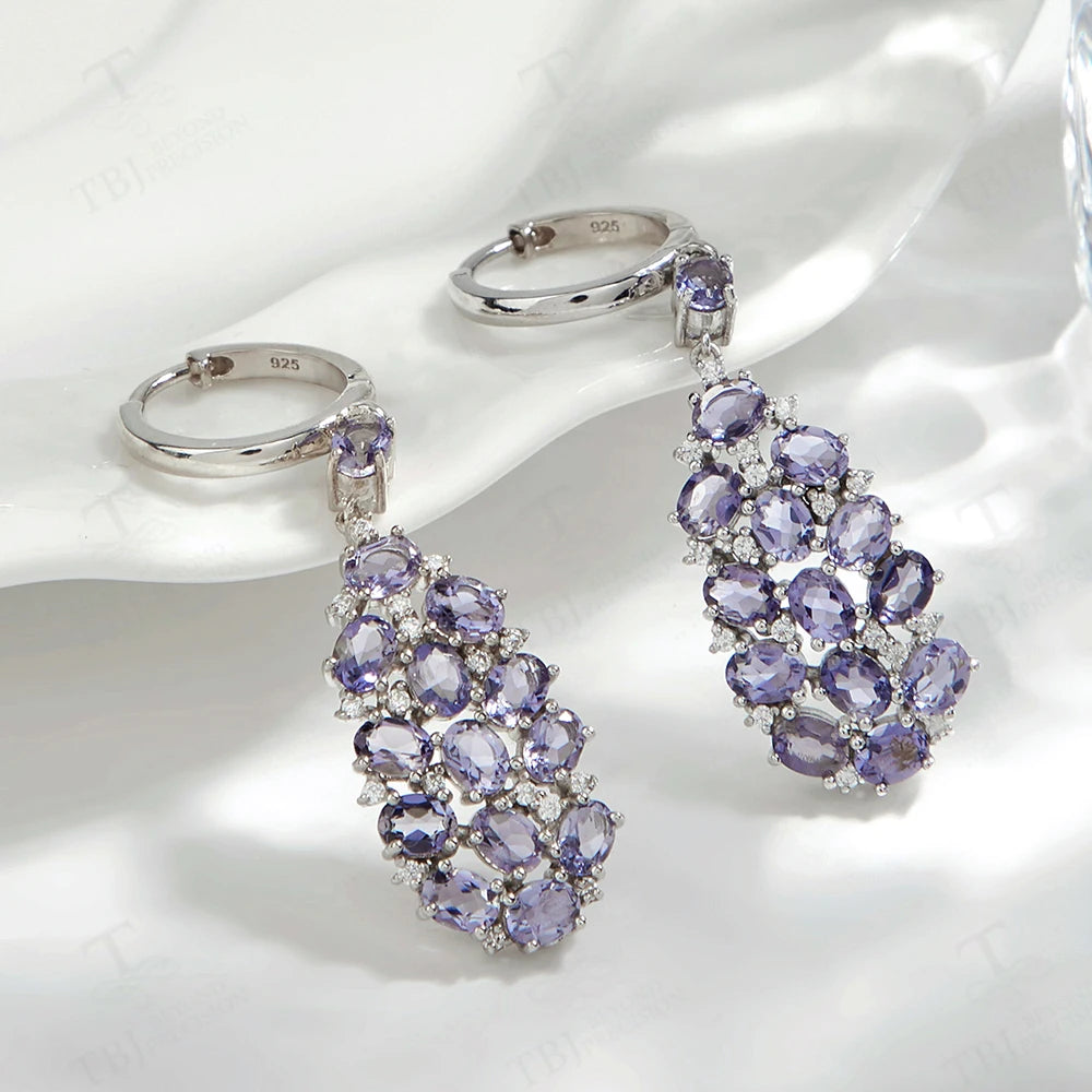 Elevate your look with our exquisite lavender-colored drop earrings, adorned with natural Iolite gemstones. Crafted with precision and attention to detail, these elegant earrings exude a sense of sophistication and luxury.