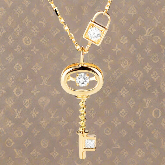 Unlock luxury with Mrs. Whoudini's Diamond Key Pendant. This stunning 18K gold pendant is GDTC certified, featuring sparkling white diamonds. The perfect statement piece for any outfit from the Thread Harbor Clothing Company.