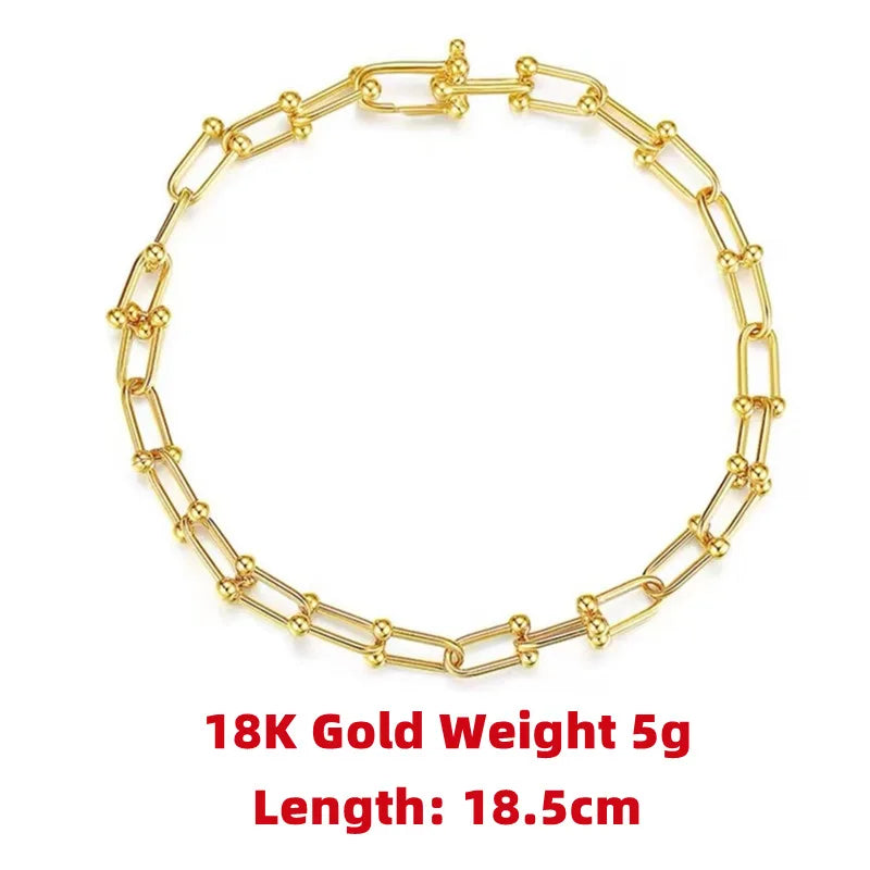 18K Gold Weight:  5g - 
Length:  18.5cm
Indulge in the ultimate luxury with our Horseshoe Chain Necklace and Bracelet Set. Made of exquisite 18K gold, this designer jewelry is the perfect accessory for any occasion. Its trendy horseshoe chain design exudes elegance and sophistication, making it a beautiful gift or to elevate any outfit.