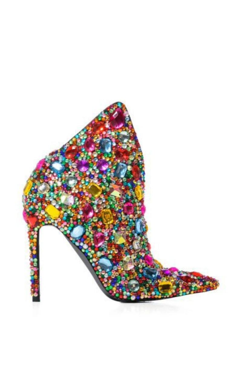 Walk with style in these luxurious Designer Women's Multi Colored Rhinestone Boots. The intricate rhinestone design adds a touch of elegance to any outfit, while the high-quality materials ensure durability and comfort. Elevate your wardrobe with these exclusive boots that are sure to turn heads.