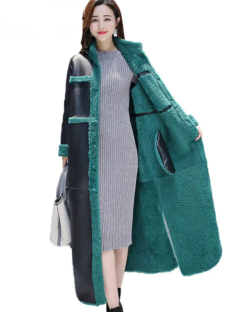 Indulge in the ultimate luxury with our Reversable Coat from the Mrs. Whoudini Collection. This coat features a cozy faux fur side for those chilly winter days, and a stylish faux leather side for a sophisticated look. Stay warm and stylish all season long!