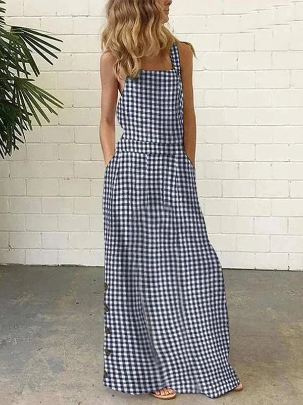 Elevate your summer wardrobe with our Bib Overall Style Maxi Dress! Available in vibrant Yellow or Blue Plaid, this statement piece from Thread Harbor Clothing Company combines the classic look of gingham with modern style. Decorative buttons down the sides add a touch of charm to this must-have dress. Feel confident and stylish in this bold and unique piece!