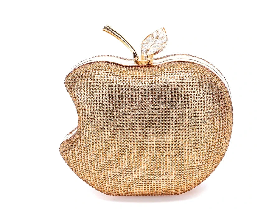    Get ready to shine with our Rhinestone Apple Novelty Clutch with Chain! The stunning rhinestone design adds a touch of glamour and the detachable chain allows for versatility in wearing. Perfect for a fun night out or a special occasion, this clutch is guaranteed to make a statement and turn heads!