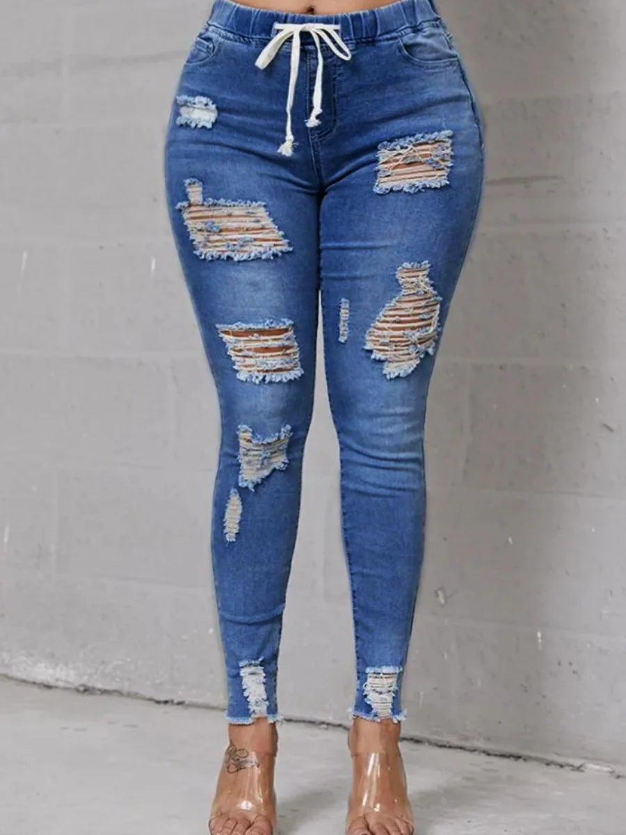 Rock your curves in our Plus Size High-Waist High Stretchy Distressed Denim Jeans! These stylish jeans provide a comfortable fit with their stretchy fabric, while the high-waisted design flatters your figure. The distressed detailing adds an edgy touch to any outfit. Say goodbye to uncomfortable jeans and hello to effortless style!