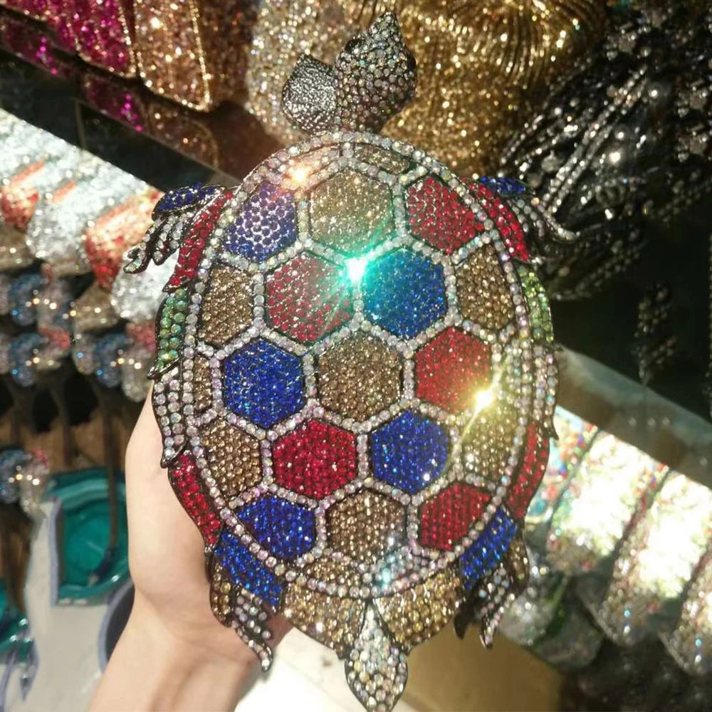 Unleash your wild side with our Rhinestone Turtle Clutch Purse. Adorned with dazzling rhinestones, this novelty bag is a statement piece that will elevate any outfit. Carry your essentials in style and make a bold fashion statement with this unique and stylish clutch purse.