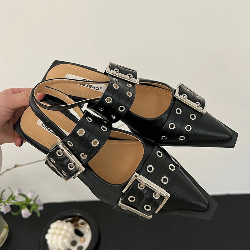 Black with double straps and buckle on  top of the shoe.  Chrome double hole buckle straps over top of foot and heel straps.  Black