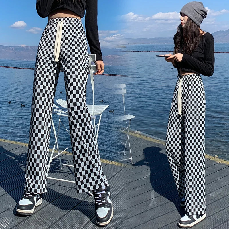 Elevate your casual wardrobe with our Woman's Black and White Checkered Lightweight Casual Pants. These pants offer comfort and style, perfect for any occasion. The black and white checkered design adds a touch of sophistication while the lightweight fabric keeps you cool and comfortable. Elevate your style today!