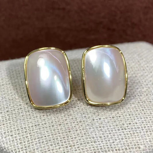 Indulge in the luxurious beauty of our Natural Seawater Sterling Silver Mabe Pearl Stud Earrings! Handcrafted with care, these earrings showcase the unique natural beauty of the sea, guaranteed to make a statement. Perfect for any occasion, they add a touch of elegance and sophistication to any outfit.