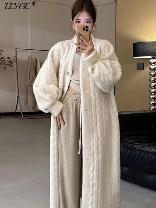 Take on the colder weather in style with our Woman's Lined Button Down Long Faux Fur Coat! Crafted from a soft cable knit pattern, this coat will keep you warm and fashionable. The full button down design offers versatility, while the faux fur lining adds a touch of luxury. Stay cozy and chic all season long!