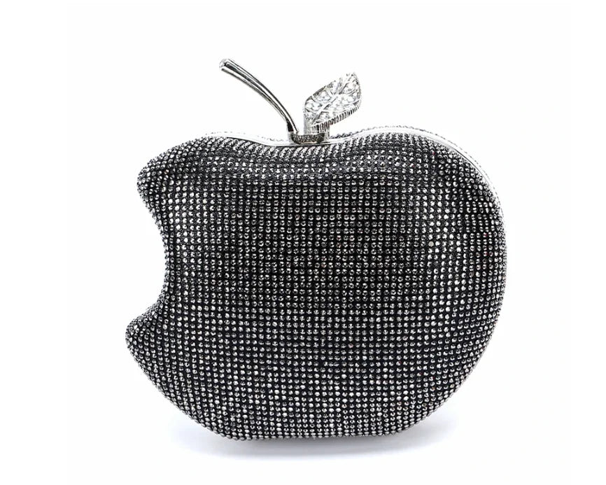    Get ready to shine with our Rhinestone Apple Novelty Clutch with Chain! The stunning rhinestone design adds a touch of glamour and the detachable chain allows for versatility in wearing. Perfect for a fun night out or a special occasion, this clutch is guaranteed to make a statement and turn heads!