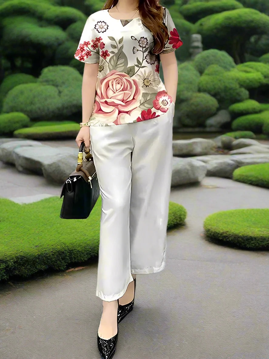 White solid color pants with a dusty rose and green floral print.  