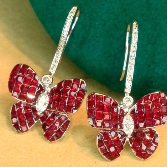 Elevate your style with our Natural Ruby Drop Butterfly and Diamond Hook Earrings. Crafted with precision, these fine jewelry pieces from Thread Harbor Clothing Company will add a touch of elegance and charm to any outfit. Embrace the beauty of natural rubies and the sparkle of diamonds in these stunning earrings.