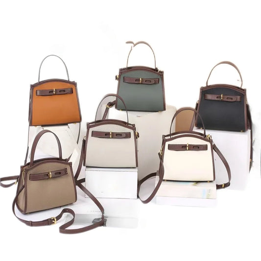 Carry sophistication and style with our Handbag Crossbody Bag. Its top handle and shoulder strap provide versatility and comfort. Perfect for any occasion, this purse is a must-have for the modern woman. Elevate your look with a touch of luxury   Comes in 5 Great Colors!