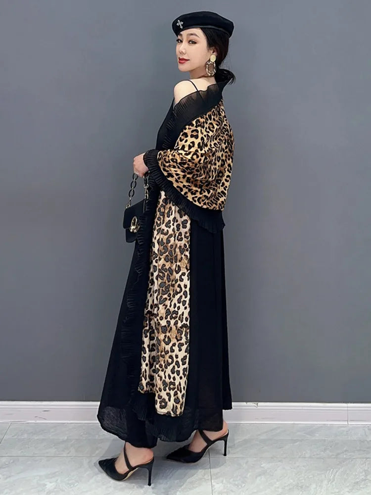 Unleash your fierce and elegant side with our Women's Elegant Leopard Print Shawl! This large wrap around shawl boasts a striking leopard print and is finished with a delicate black chiffon trim. Experience comfort and style in one luxurious accessory. Transform any outfit with this statement piece!