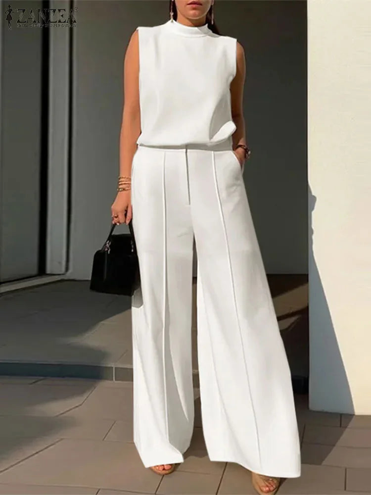 Elevate your wardrobe with our Women's Beige Two Piece Sleeveless Tank with Wide Leg Trousers. This versatile ensemble exudes effortless style and comfort with its sleeveless tank and flowy wide leg trousers. Perfect for any occasion, our high-quality fabric will make you feel luxurious and confident.