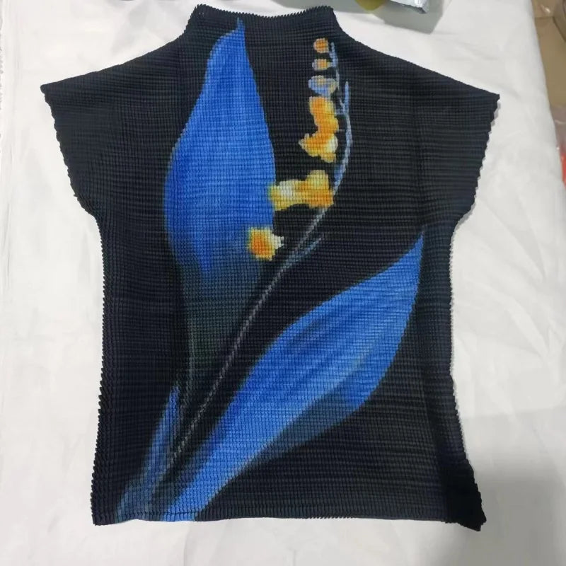 black tee shirt with blue floral print.  Elevate your wardrobe with our Elegant Black Short Sleeve Tee Shirt! Featuring a stunning high neckline and a large floral print in shades of blue, this top is sure to turn heads. Made with stretch fabric for ultimate comfort, it also boasts two large blue leaf designs with pops of beige and yellow for a chic touch.