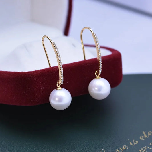 Indulge in luxury and elegance with our Fashion Jewelry Luxury Wire Pearl Earrings. These stunning dangle earrings feature beautiful 10-11MM freshwater white pearls with a sparkling diamond-set detail. Crafted from 925 silver, they add a touch of sophistication to any outfit. Elevate your style with these beautiful earrings today!