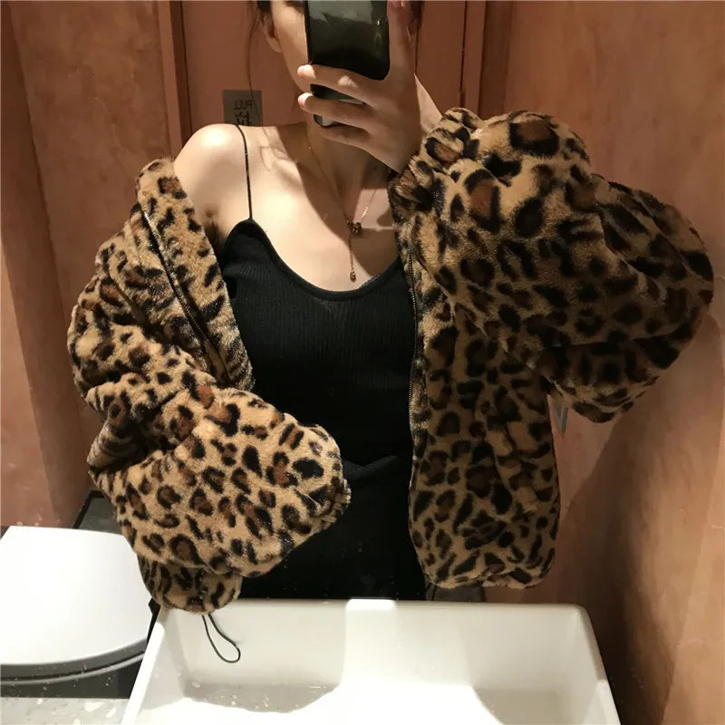 Unleash your wild side with our Faux Fur Leopard Print Jacket! Featuring a trendy collar, zipper closure, and functional pockets, this cozy coat will keep you warm and stylish. Turn heads and make a statement with this must-have piece.