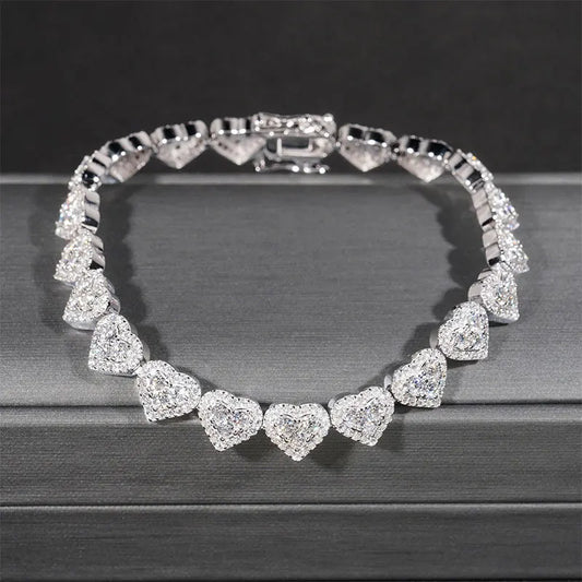 Fall in love with our stunning Moissanite Heart Bracelet and Necklace! Made with 925 sterling silver, this fine jewelry set exudes elegance and sophistication. The sparkling moissanite heart design adds a touch of romance and luxury to any outfit. Treat yourself or a loved one to this beautiful accessory for a timeless and chic look!