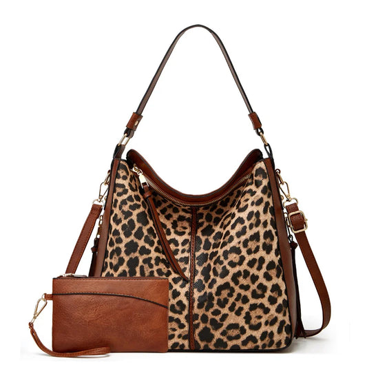 Stay stylish and organized with our Large Capacity Leopard/Cow Print Shoulder Bag. Includes a matching wallet for added convenience. Perfect for on-the-go fashionistas!
