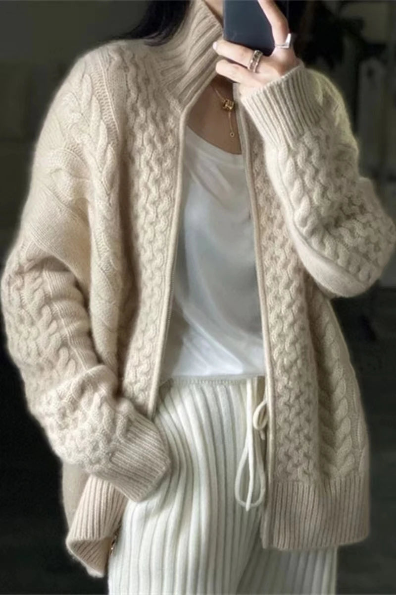 Stay warm and stylish in our 100% Wool Cable Knit Cardigan Sweater! The high neck and zipper front closure add a modern touch to this classic piece from Thread Harbor Clothing Company. Perfect for colder weather, this sweater will keep you cozy and on-trend