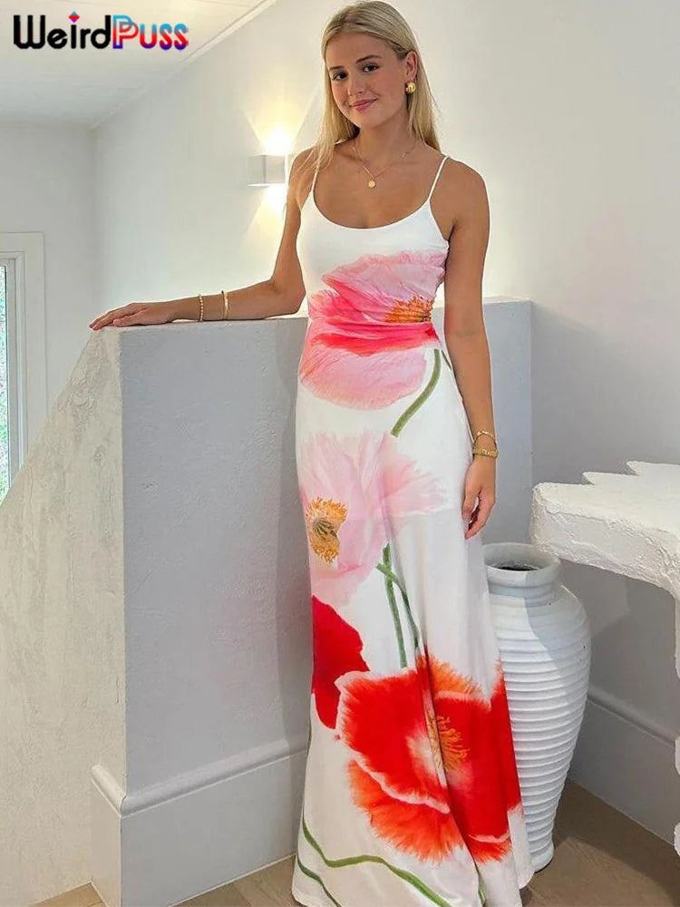 Take your summer style to the next level with our Summer Spaghetti Strap Maxi Length Backless Bodycon Dress. The white background beautifully contrasts with the vibrant pink, red, and orange flowers, making a bold statement. The flattering bodycon fit and backless design will make you stand out in any crowd.