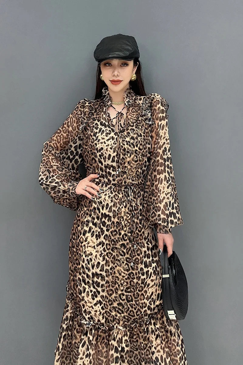 Indulge in fierce and feminine style with our Chiffon Leopard Print A Line Dress! The long, full ruffle edge sleeves with elastic wrist provide a chic and comfortable fit, while the spliced skirt adds a touch of drama. Embrace your wild side and turn heads with this statement-making dress.