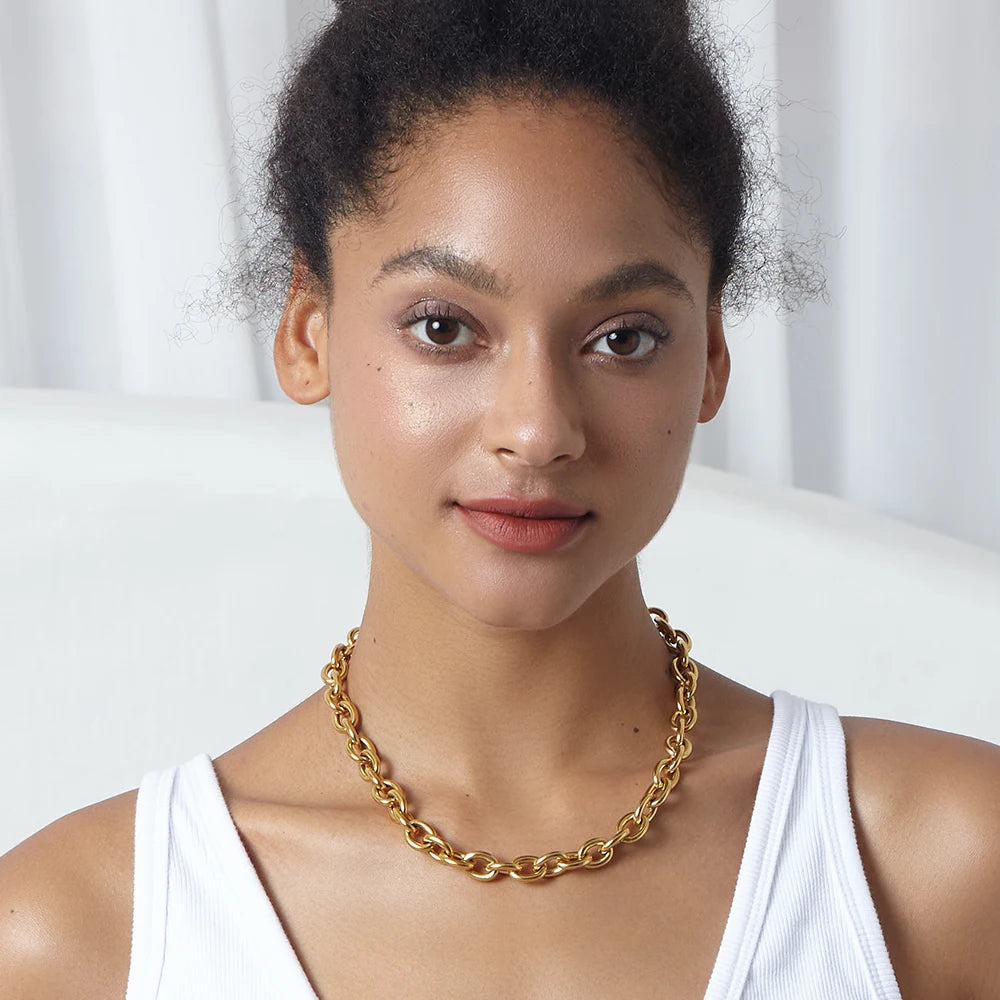 Level up your accessory game with this Chunky Gold Link Chain Necklace. Crafted from high quality stainless steel, this necklace is both durable and stylish. Add a touch of glamour to any outfit with its bold and chunky design. Elevate your style with this statement piece!