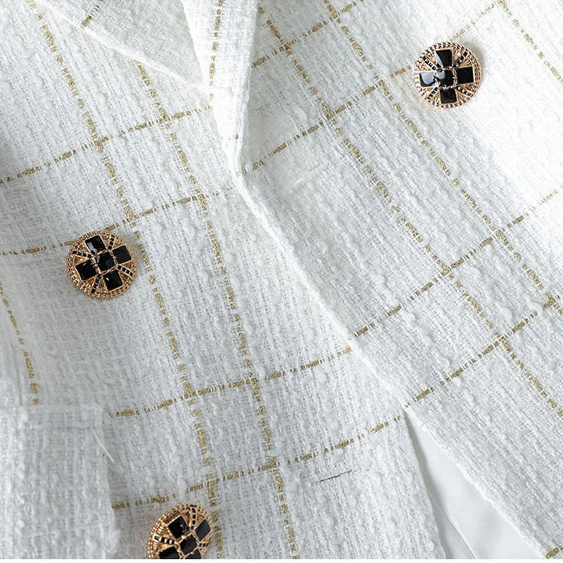 Elevate your style with our Double Breasted White Wool Blend Tweed Blazer! With a thin black plaid design, this blazer is perfect for making a bold and sophisticated statement. Made with a high-quality wool blend, it provides both comfort and style. Also available in black with white plaid.  Gold Buttons on white jacket