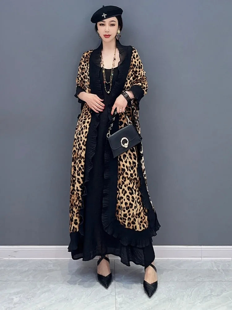 Unleash your fierce and elegant side with our Women's Elegant Leopard Print Shawl! This large wrap around shawl boasts a striking leopard print and is finished with a delicate black chiffon trim. Experience comfort and style in one luxurious accessory. Transform any outfit with this statement piece!