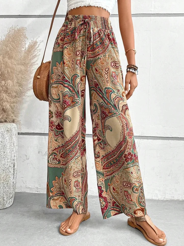 Make a statement with these retro, digital print high waist pants. Not only do they have an elastic waist for maximum comfort, but the wide leg style will give you a boho-chic look. Perfect for any casual occasion, these pants are a fun addition to any wardrobe. Go ahead, flaunt your unique style!