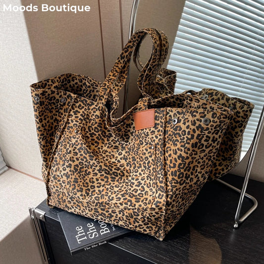 This Large Capacity Leopard Print Luxury Canvas Tote Bag is a must-have for fashionistas and practical shoppers alike! With its spacious interior and stylish leopard print design, this tote bag is perfect for carrying all of your essentials in style. Make a statement with this luxurious and functional accessory!