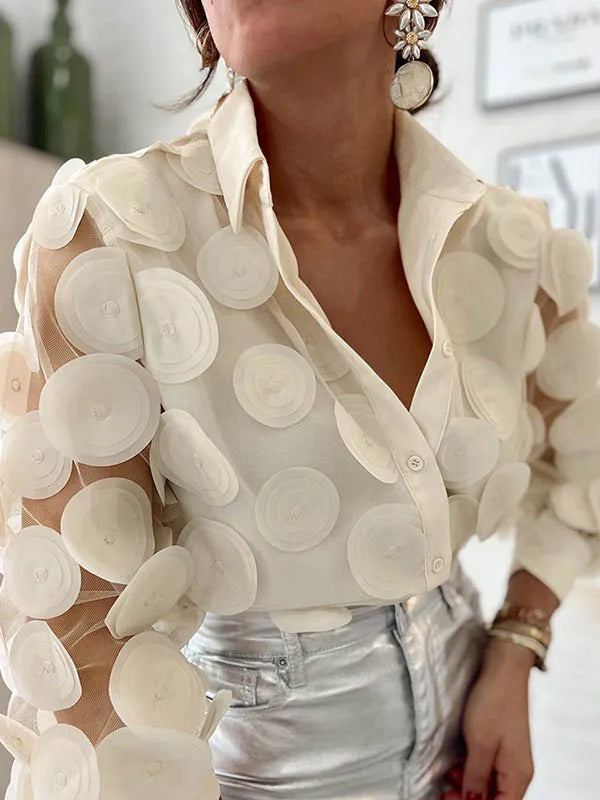 Experience elegance and sophistication in our Beige Sheer Long Sleeve Blouse. Featuring large circle appliques on a delicate mesh fabric, this blouse is perfect for any occasion. Embrace your inner fashionista with Thread Harbor Clothing Company.