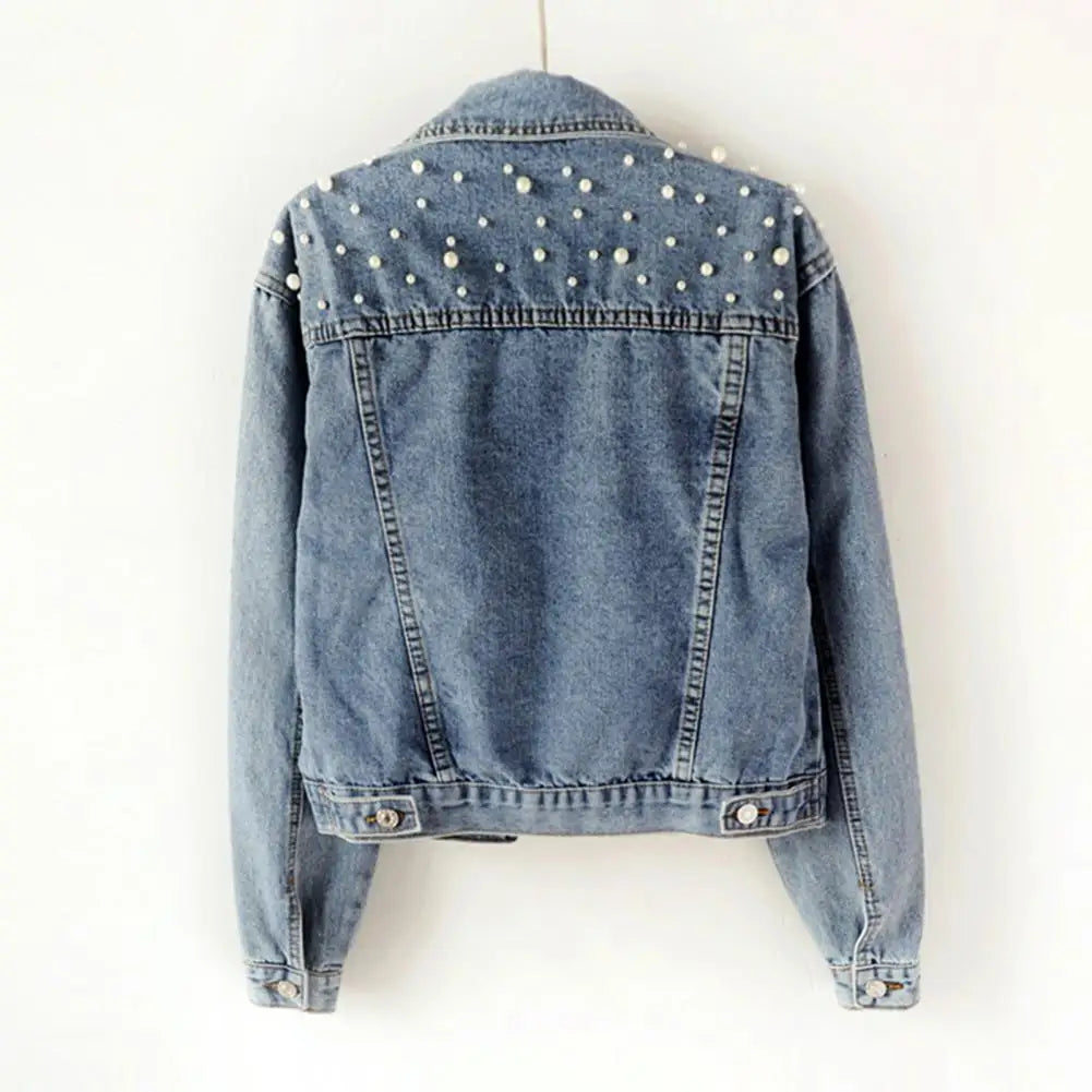 Get ready to rock the denim look with our Denim Jacket! With its solid color and single breasted design, this cropped jacket is perfect for any occasion. Stay warm and stylish with its thermal lining and beaded accents, while adding a touch of elegance with faux pearl details. Upgrade your wardrobe with this must-have piece!