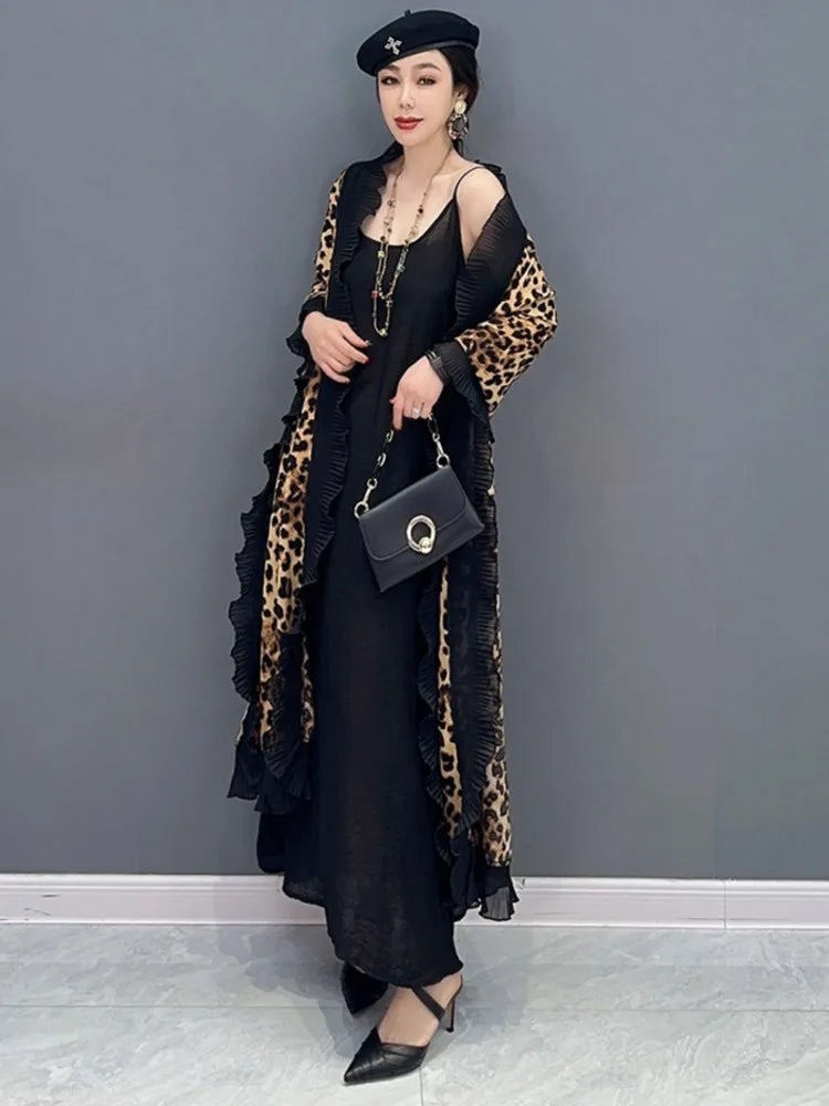 Unleash your fierce and elegant side with our Women's Elegant Leopard Print Shawl! This large wrap around shawl boasts a striking leopard print and is finished with a delicate black chiffon trim. Experience comfort and style in one luxurious accessory. Transform any outfit with this statement piece!