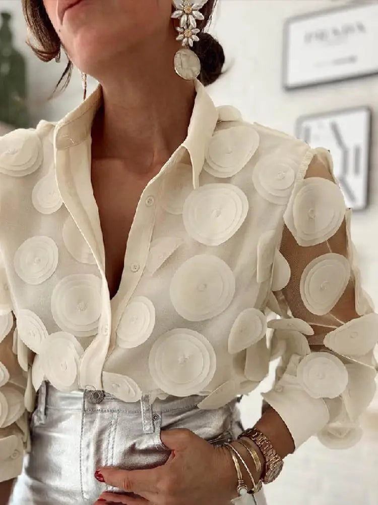 Experience elegance and sophistication in our Beige Sheer Long Sleeve Blouse. Featuring large circle appliques on a delicate mesh fabric, this blouse is perfect for any occasion. Embrace your inner fashionista with Thread Harbor Clothing Company.