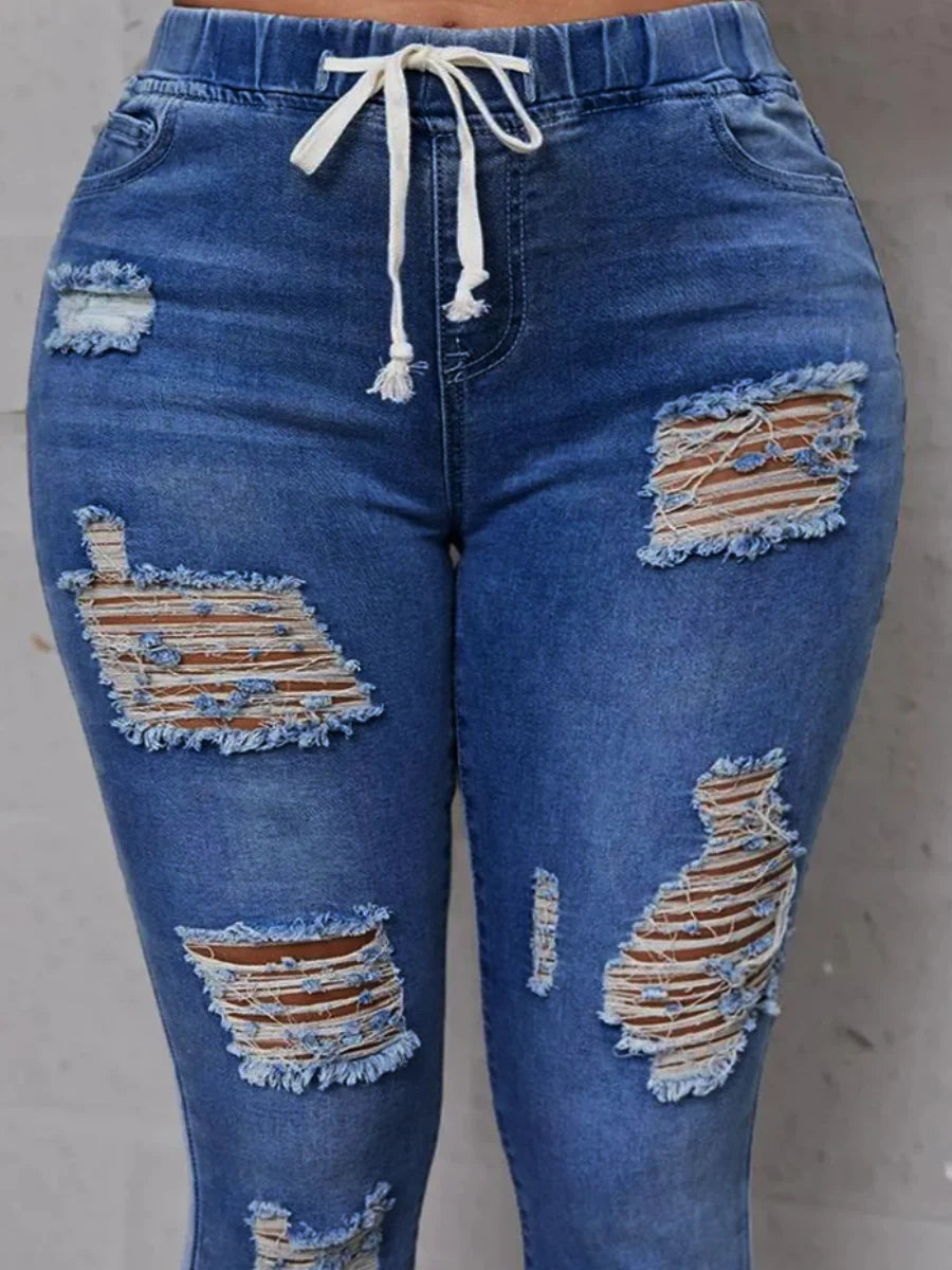 Rock your curves in our Plus Size High-Waist High Stretchy Distressed Denim Jeans! These stylish jeans provide a comfortable fit with their stretchy fabric, while the high-waisted design flatters your figure. The distressed detailing adds an edgy touch to any outfit. Say goodbye to uncomfortable jeans and hello to effortless style!