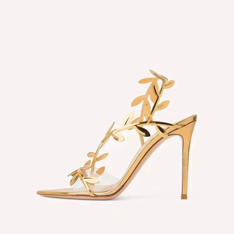 These shoes are so elegant.  the sole of the shoe is gold.  there is a gold branch with gold leaf's that wraps across the toes and up across the top of the foot and up and across the heel.  