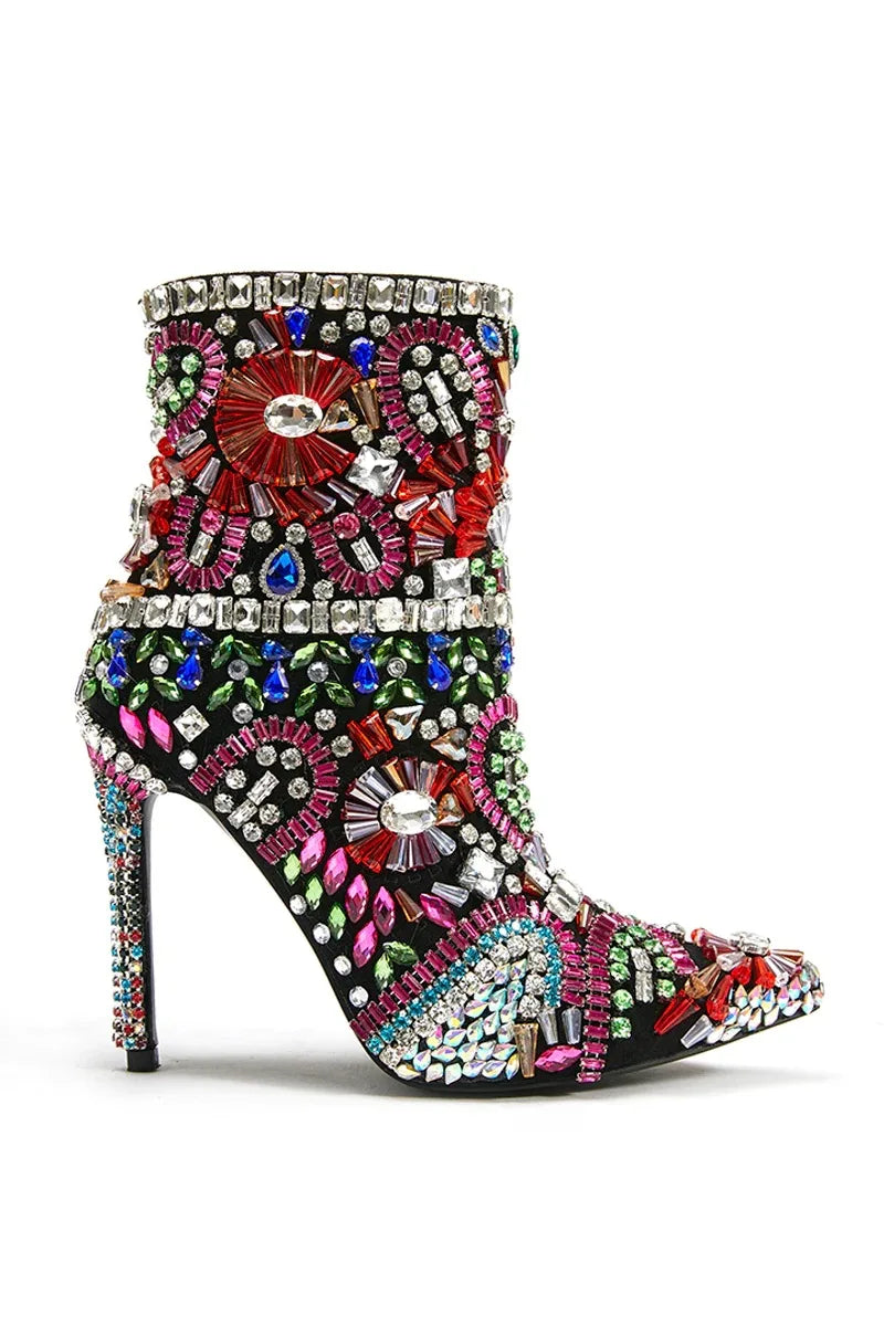 Walk with style in these luxurious Designer Women's Multi Colored Rhinestone Boots. The intricate rhinestone design adds a touch of elegance to any outfit, while the high-quality materials ensure durability and comfort. Elevate your wardrobe with these exclusive boots that are sure to turn heads.