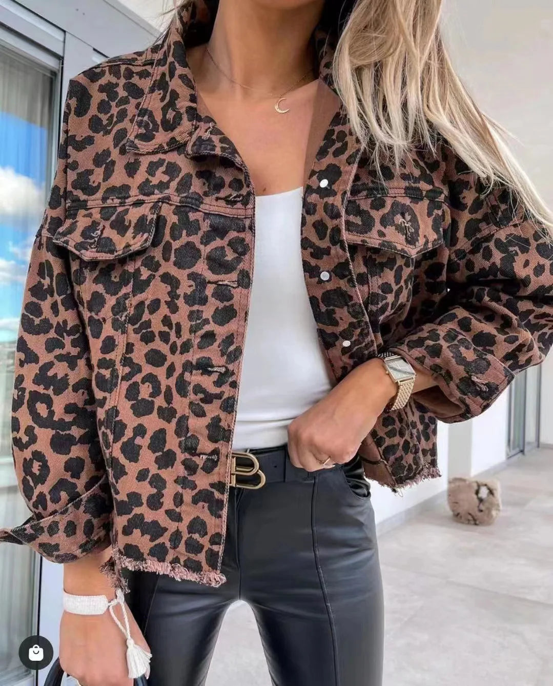 Unleash your wild side with our Raw Hem Trendy Leopard Denim Coat for Women! Made with high-quality denim, this coat features a fierce leopard print design and a stylish raw hem. Stay on-trend and make a statement with this must-have piece.