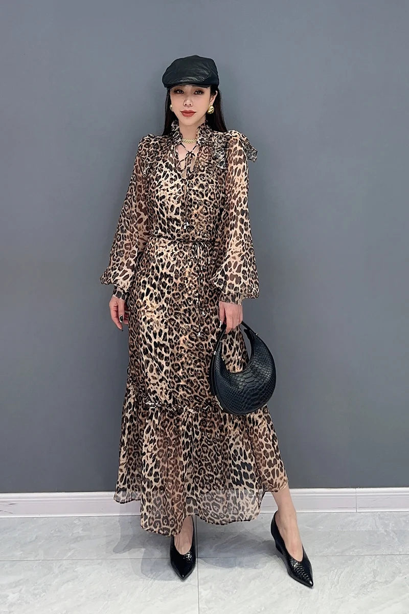 Indulge in fierce and feminine style with our Chiffon Leopard Print A Line Dress! The long, full ruffle edge sleeves with elastic wrist provide a chic and comfortable fit, while the spliced skirt adds a touch of drama. Embrace your wild side and turn heads with this statement-making dress.