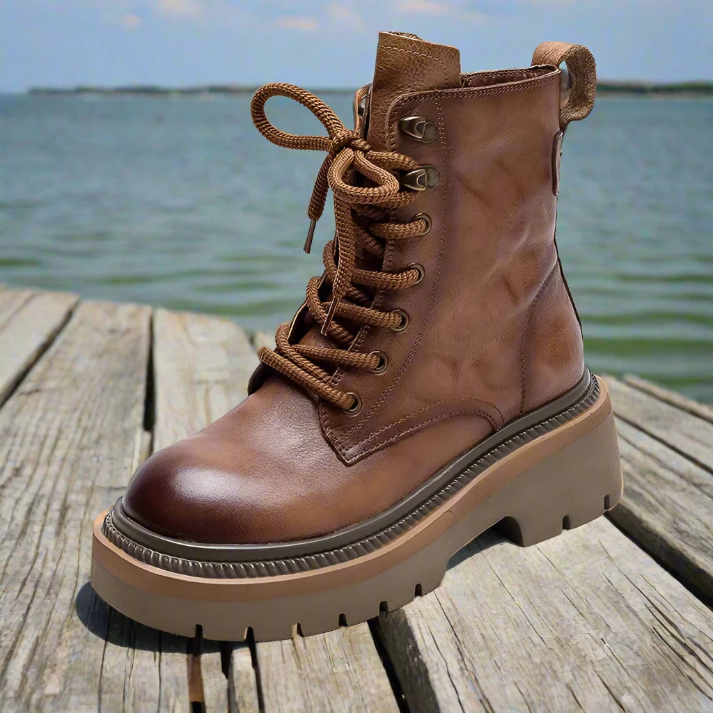 light brown - Experience the perfect combination of style and comfort with our Women's Leather Combat Boots. Made with high-quality leather, these boots come in a stunning brown and black color and feature lace-up detailing for a touch of edginess. Conquer any terrain with ease and stand out in these must-have boots.