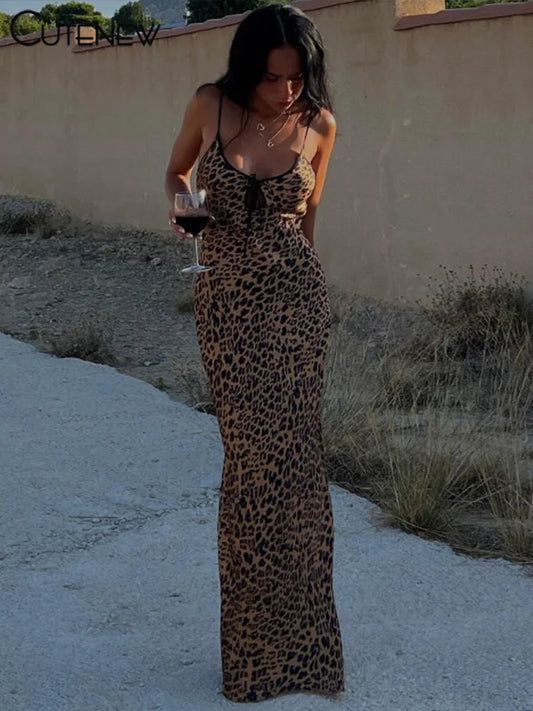 Embody the wild beauty of a leopard with our Sexy Leopard Print Maxi Dress. The low neckline and backless design will make you feel confident, while the front tie adds a touch of elegance. Perfect for a night out or a special occasion, this dress will make you stand out in any crowd!