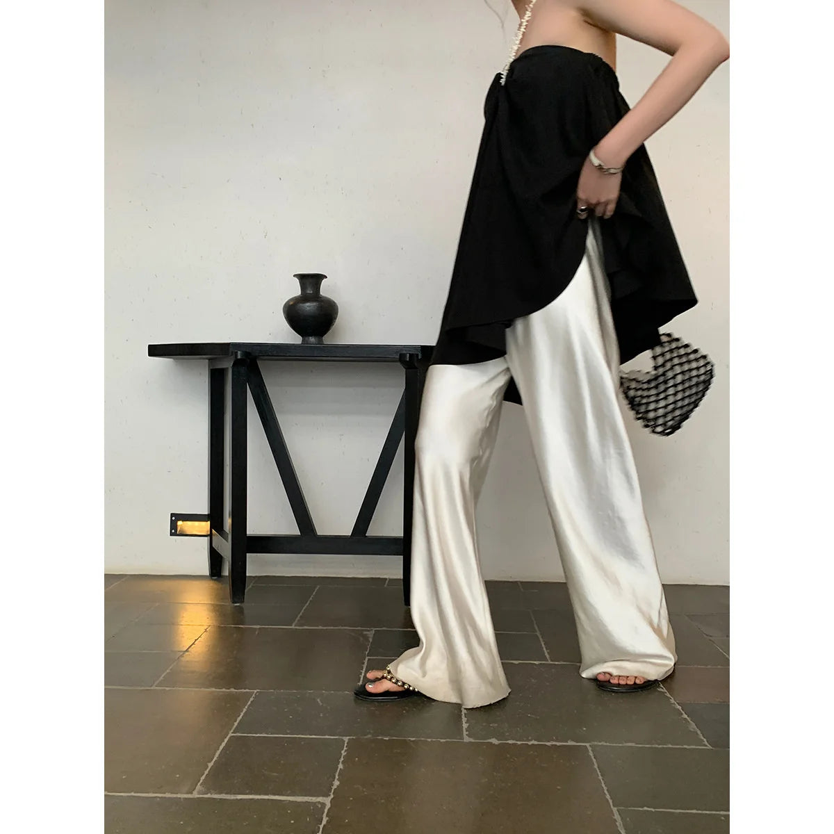 Introducing our Casual Long Wide Leg Elastic Waist Satin Trousers! Perfect for any casual occasion, these trousers offer comfort and style with its elastic waistband and wide leg design. Elevate your wardrobe with this must-have piece!