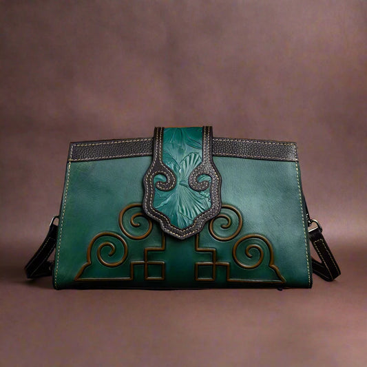 This genuine leather Women's Bag is a must-have accessory for any lady. Handmade with care and featuring a relief design, it is both stylish and functional. The crossbody and clutch with strap options make it perfect for any occasion. Available in teal, orange, and black, it is the perfect addition to your wardrobe!