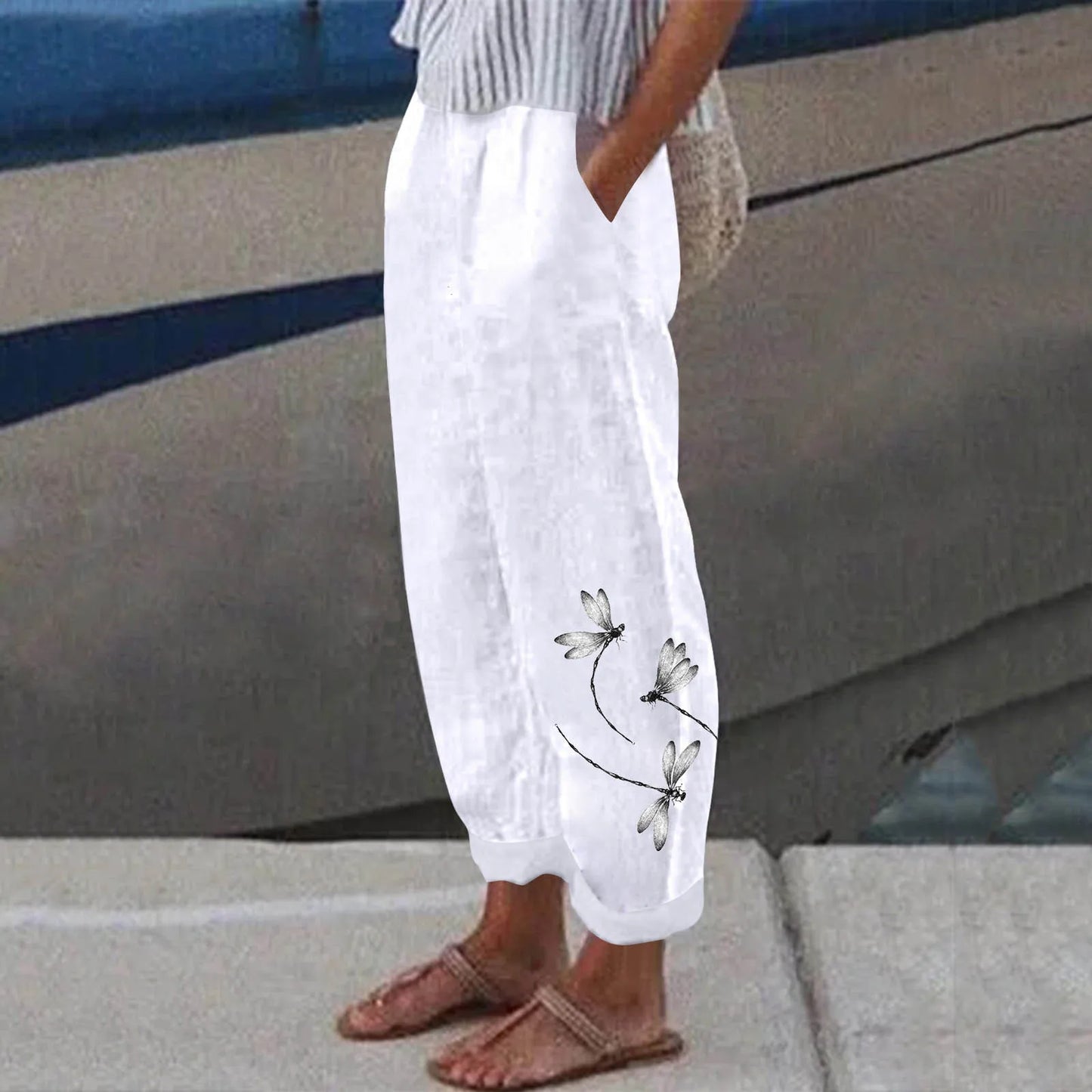 Get ready for summer with these stylish White Linen Pants! Featuring a unique design print and convenient front pockets, these pants are perfect for a day at the beach or a casual summer outing. Look and feel cool and comfortable in these must-have summer pants. Order now!