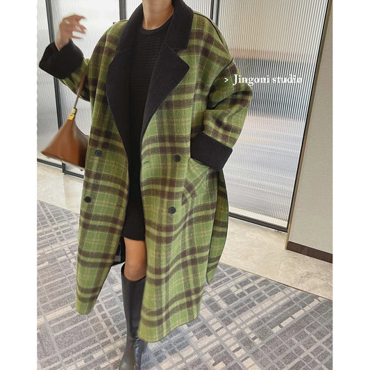 Stay stylish and warm this winter with our Woman's Warm Winter Double Breasted Plaid Wool Mid Length Reversible Coat from the Mrs. Whoudini Collection! Made with high-quality wool, this coat is perfect for keeping you cozy during the cold months. Its double-breasted design and reversible feature make it a versatile and stylish addition to your wardrobe. Don't sacrifice fashion for comfort - get the best of both worlds with our coat!