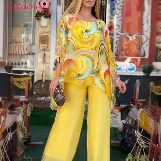 Unleash your vibrant and free-spirited style with our Women's Colorful Print Chiffon Bat Sleeve Blouse and Wide Leg Pants Set! The flowing chiffon material and loose fit provide ultimate comfort, while the bold and colorful print adds a touch of excitement to any occasion. Elevate your look and express your individuality with this effortlessly chic set.